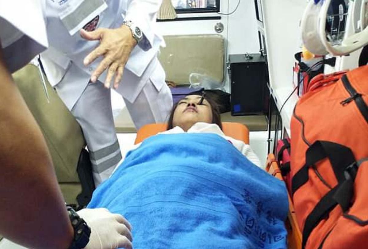 eyebrow pencil stuck in women eyes while doing makeup in moving car in bangkok