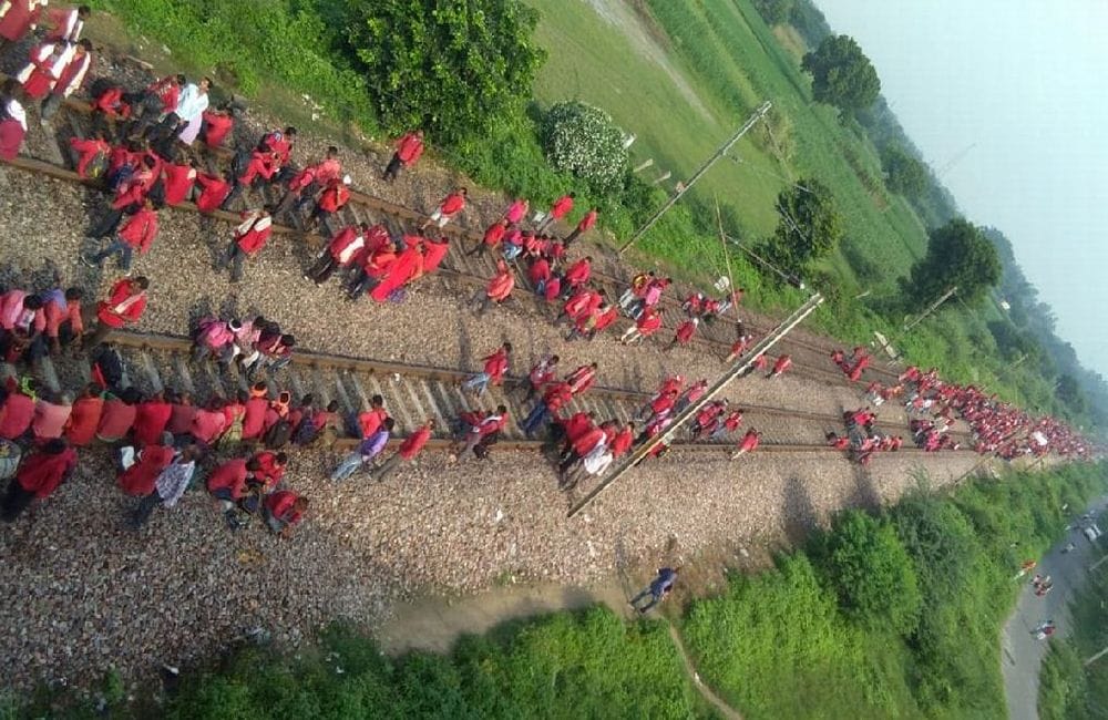 railway track blocked by coolies demanding permanent job