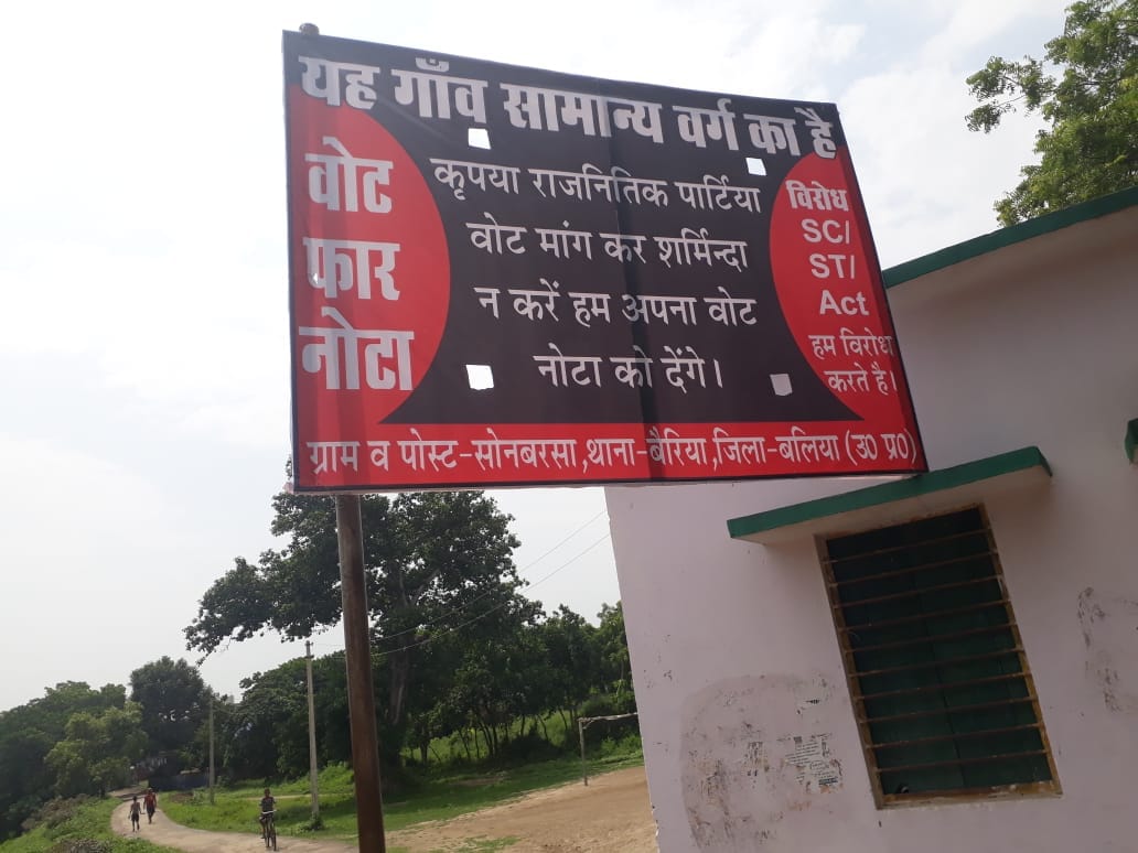 poster placed in favour of NOTA at uttar pradesh this village