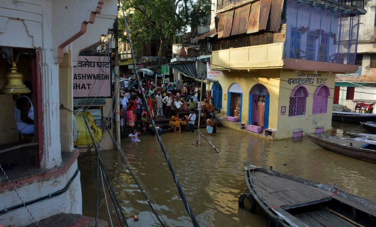 Ganga river water level increasing very fast in varanasi boats float in street
