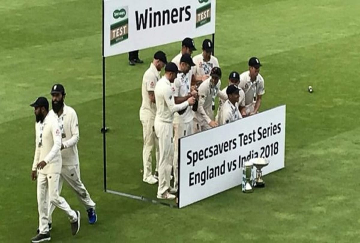 Moeen Ali and Adil Rashid runs away during England's victory champagne celebration