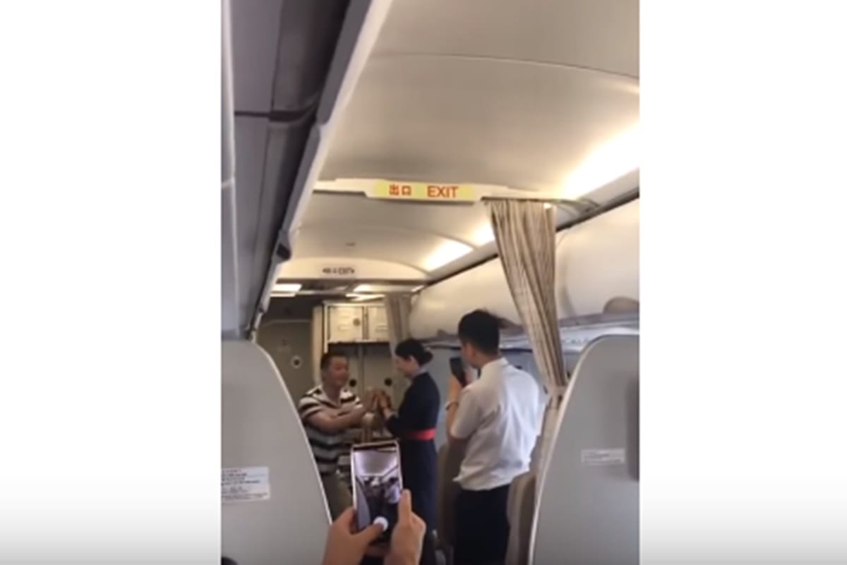 flight attendant accepts mid air proposal from boyfriend and as a result got dismissal letter