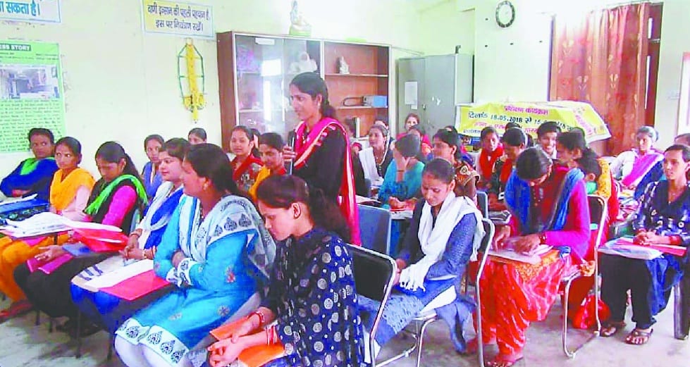 WOMEN LEARNING DRESS DESIGNING