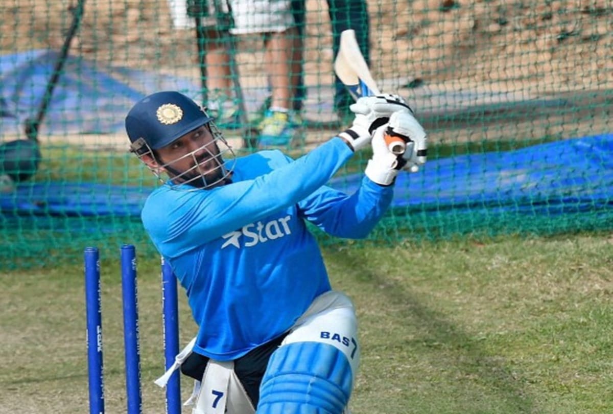ms dhoni 35 feet cutout stands in front of the cricket stadium