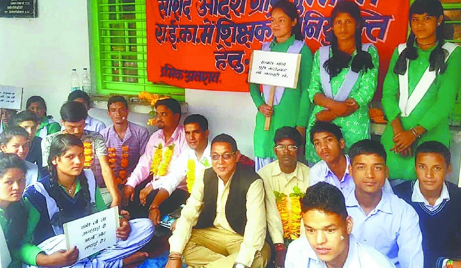 Deteriorating condition of two students sitting on dharni