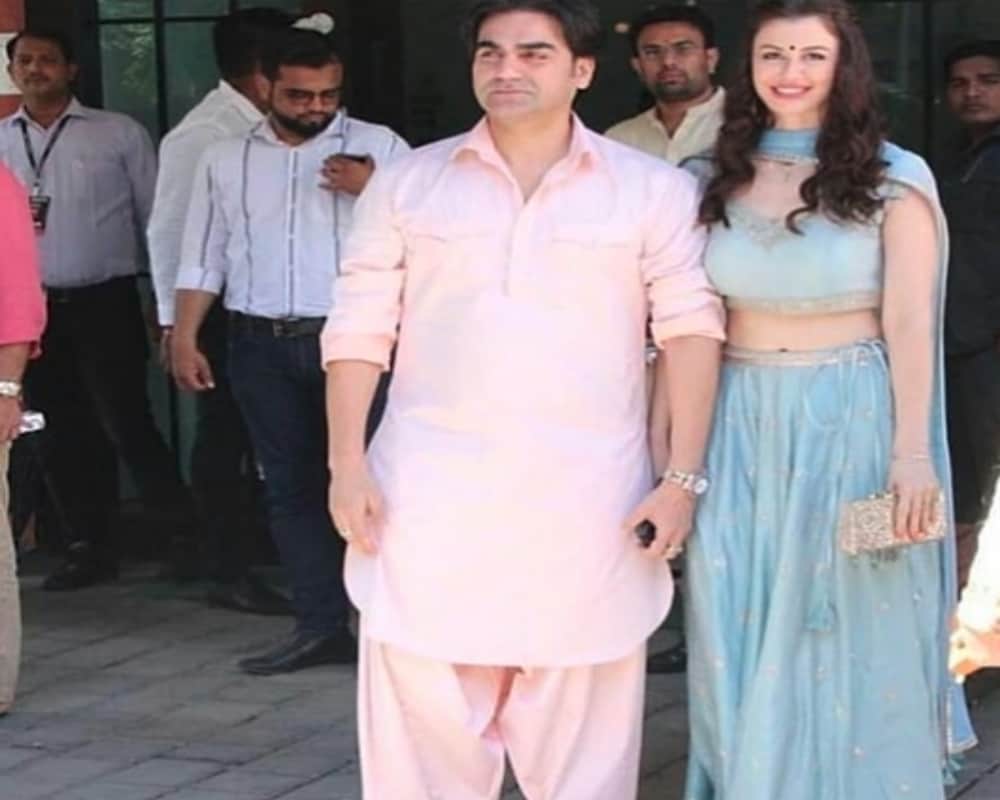 Malaika Arora dazzles in red Arbaaz Khan walks with girlfriend Giorgia