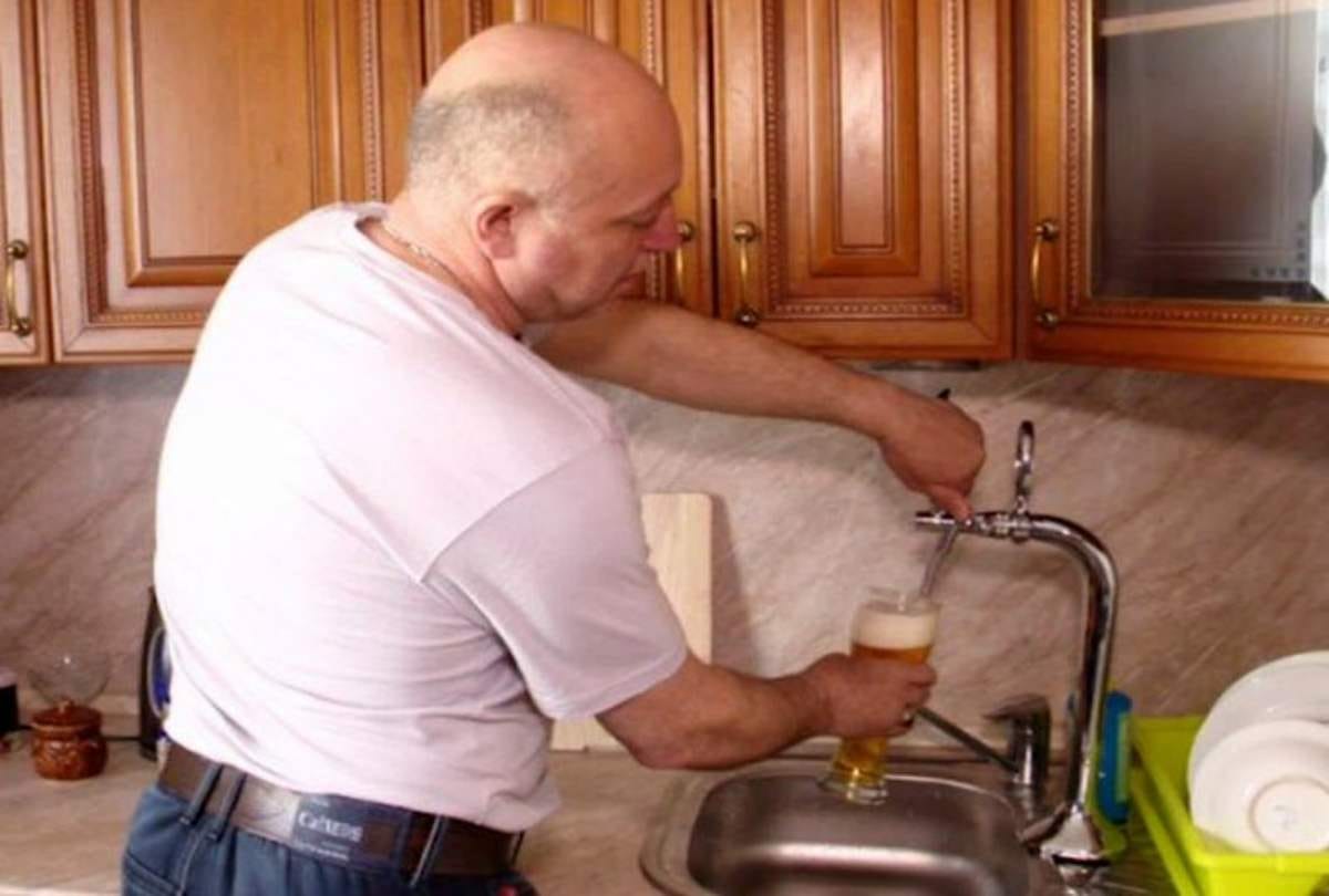 beer from tap this man has beer pipeline connection in home in Russia
