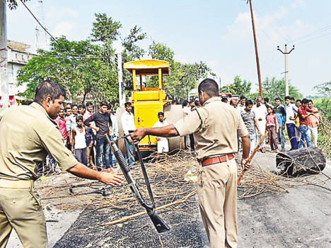 Girl in grip of road roller, death