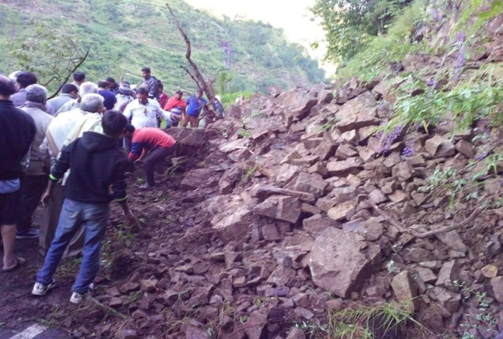 Pilgrims clear stones from yamunotri highway after debris