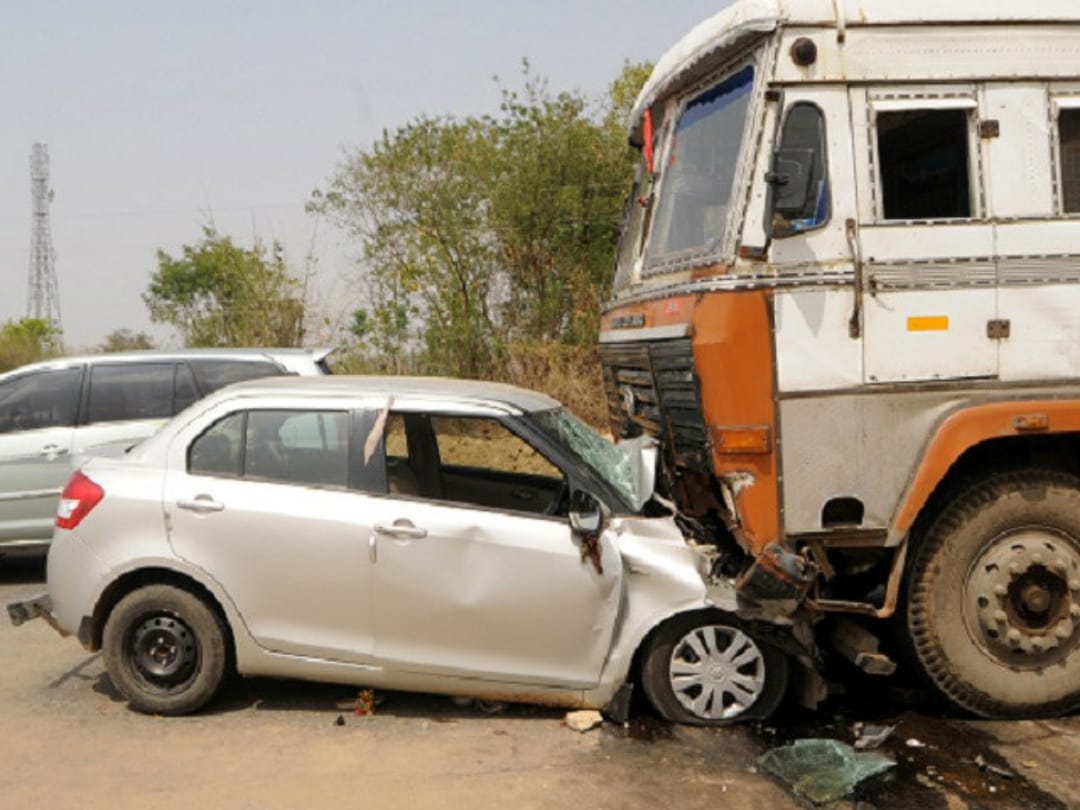 truck hits car, four people injured in car