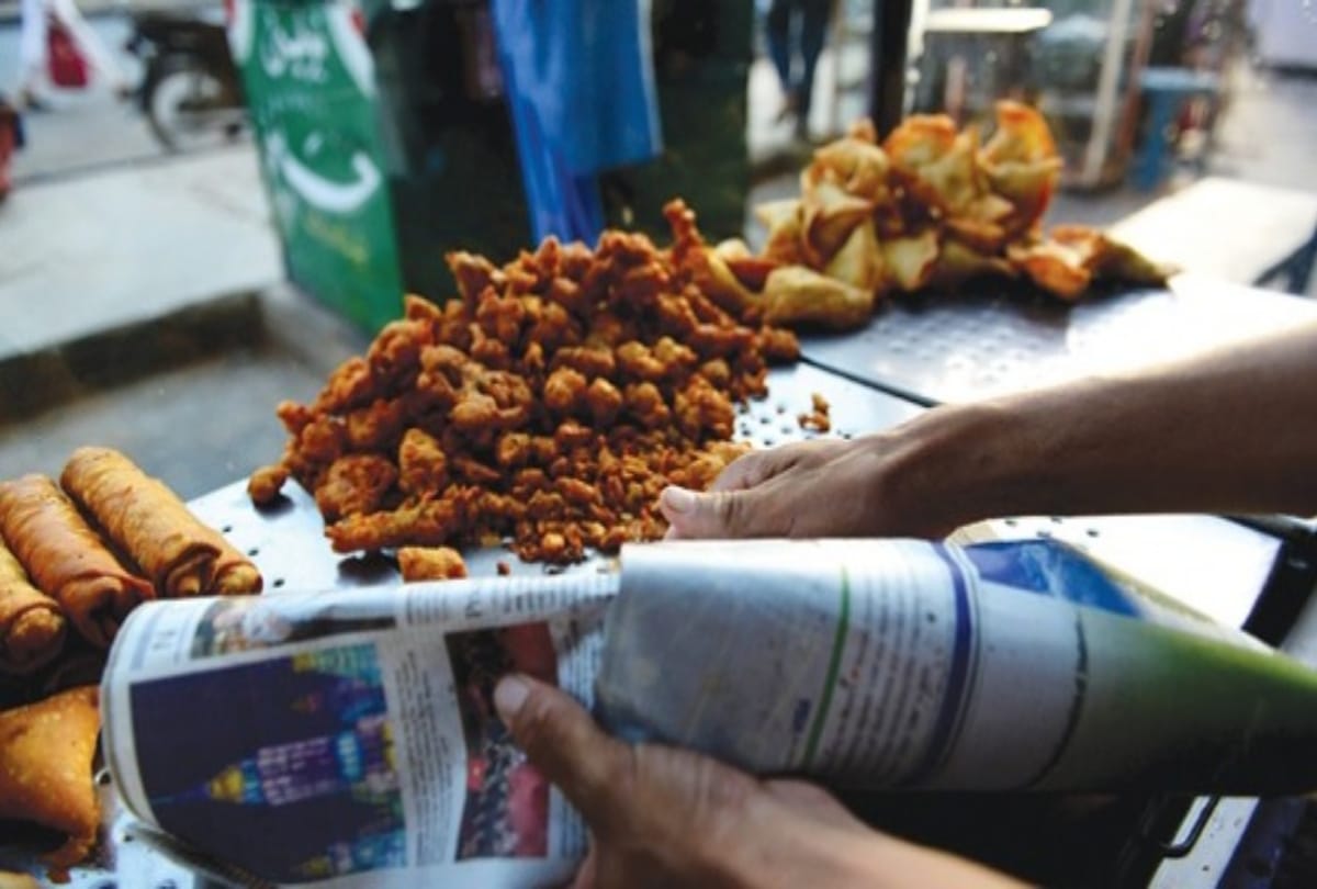 Very Dangerous to eat food on the newspaper