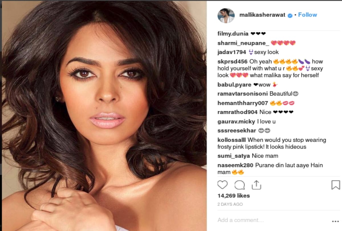 Mallika Sherawat look sensuous in this black backless gown