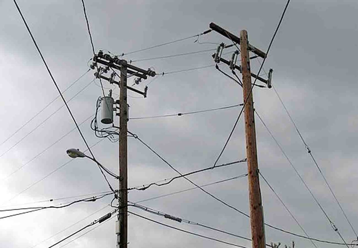 village head's son forced young man to climb on electric pole
