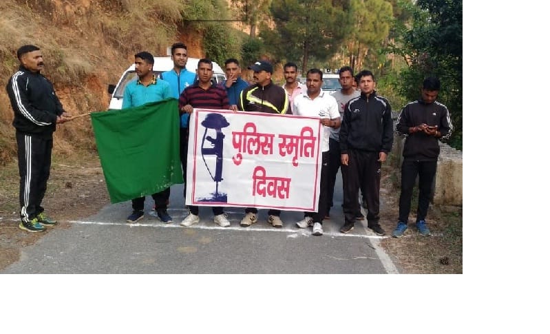 Police personnel run in memory of martyrs