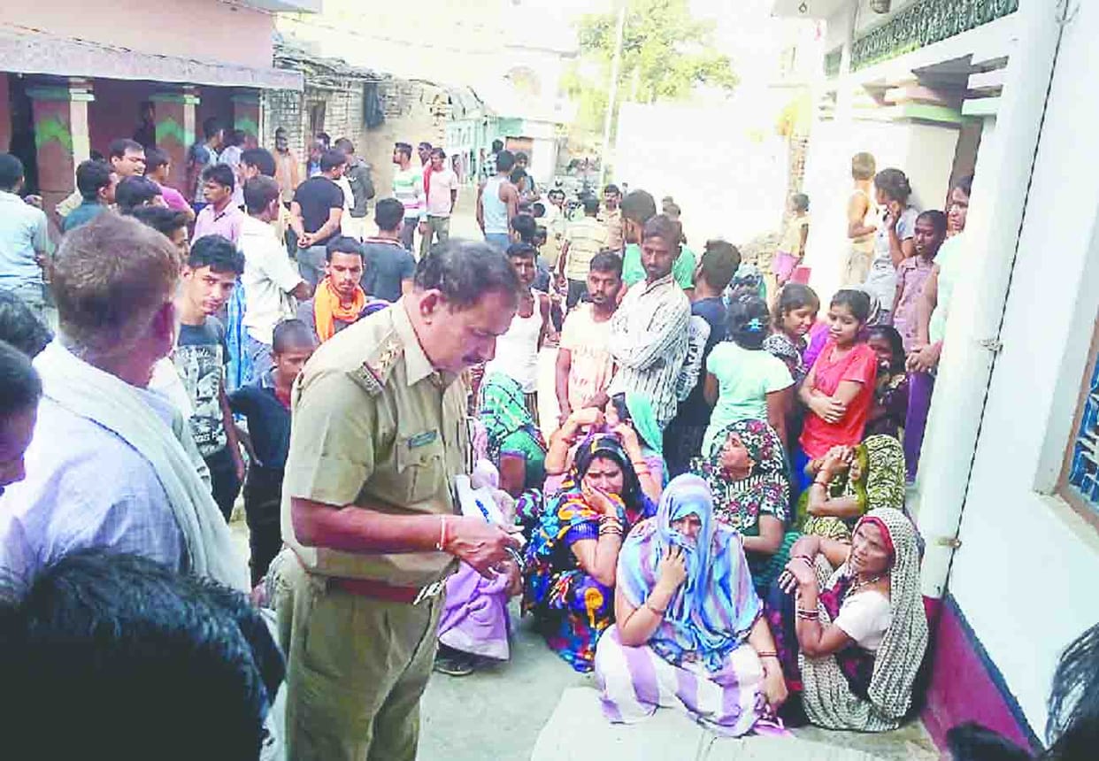 man shot dead in snatching rifle with son