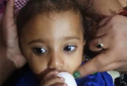 women saves a child into air before train hit his father and mother