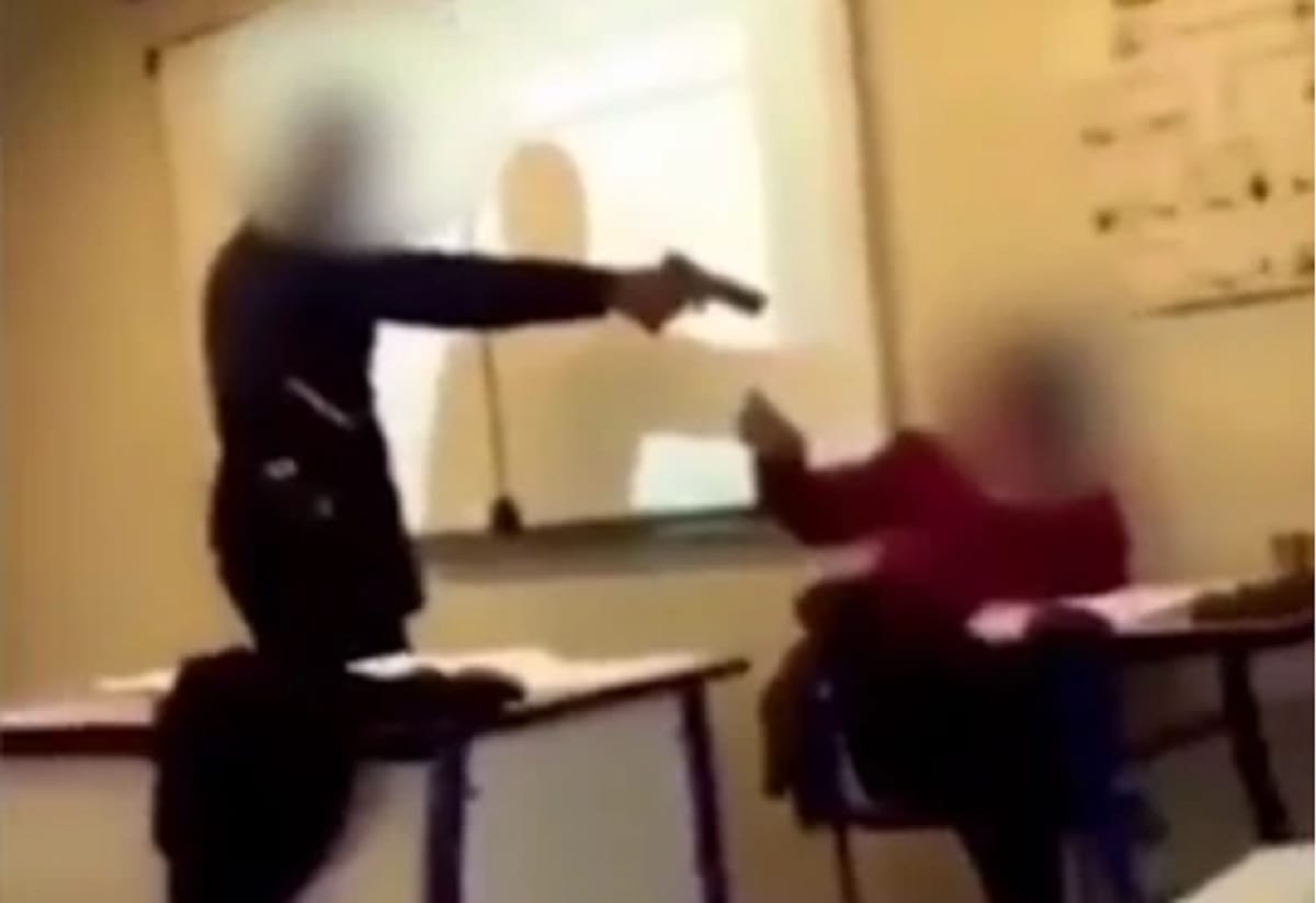 video goes viral when a teenage schoolboy pointed a gun at his teacher