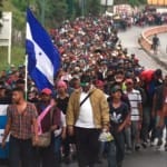 refugees cross into Mexico from river