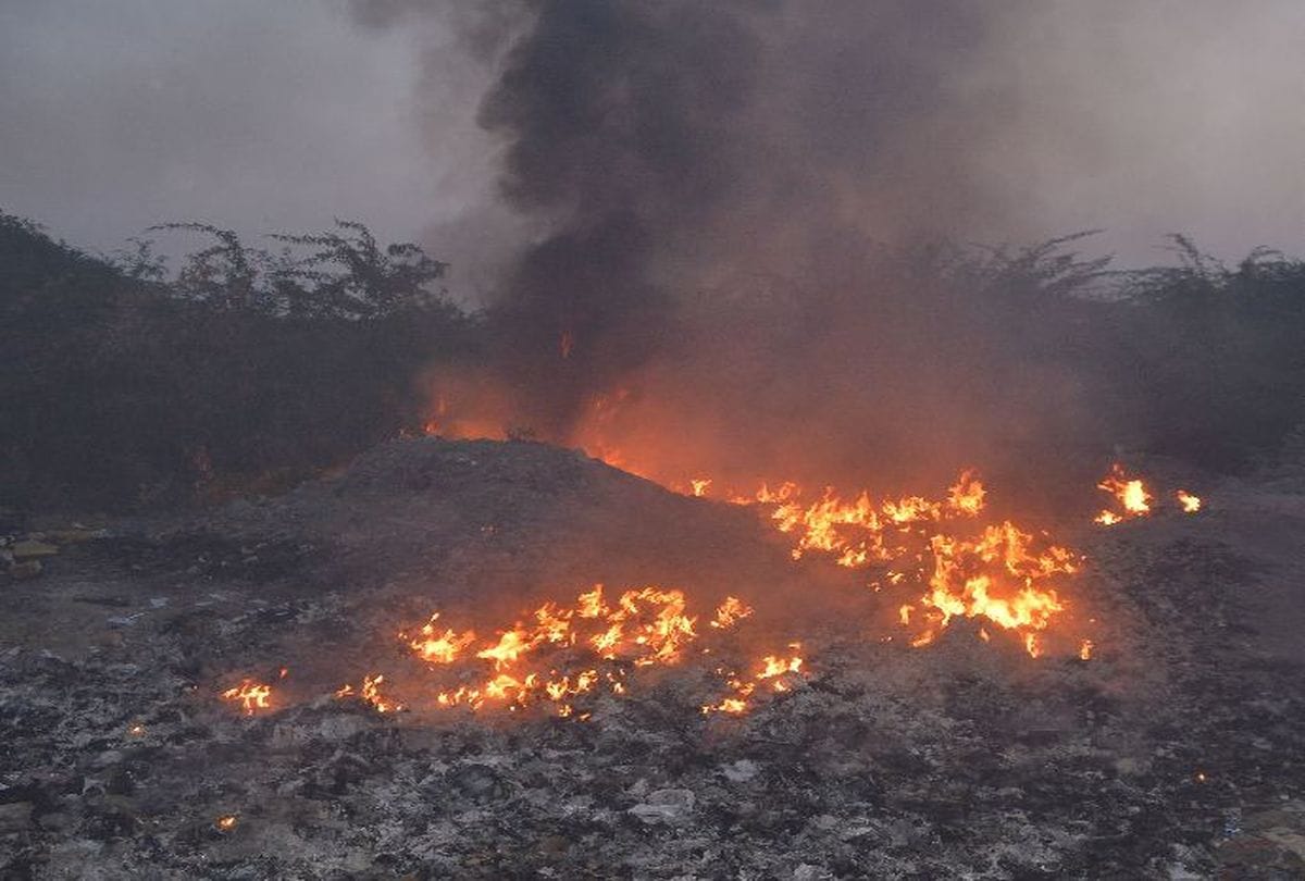 openly burning garbage around the Taj Mahal in agra