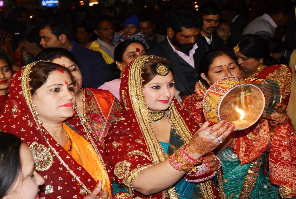 Suhaginas looked the moon after end the fast on Karva Chauth