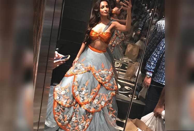 malaika arora look beautiful in orange lehanga on karwachauth