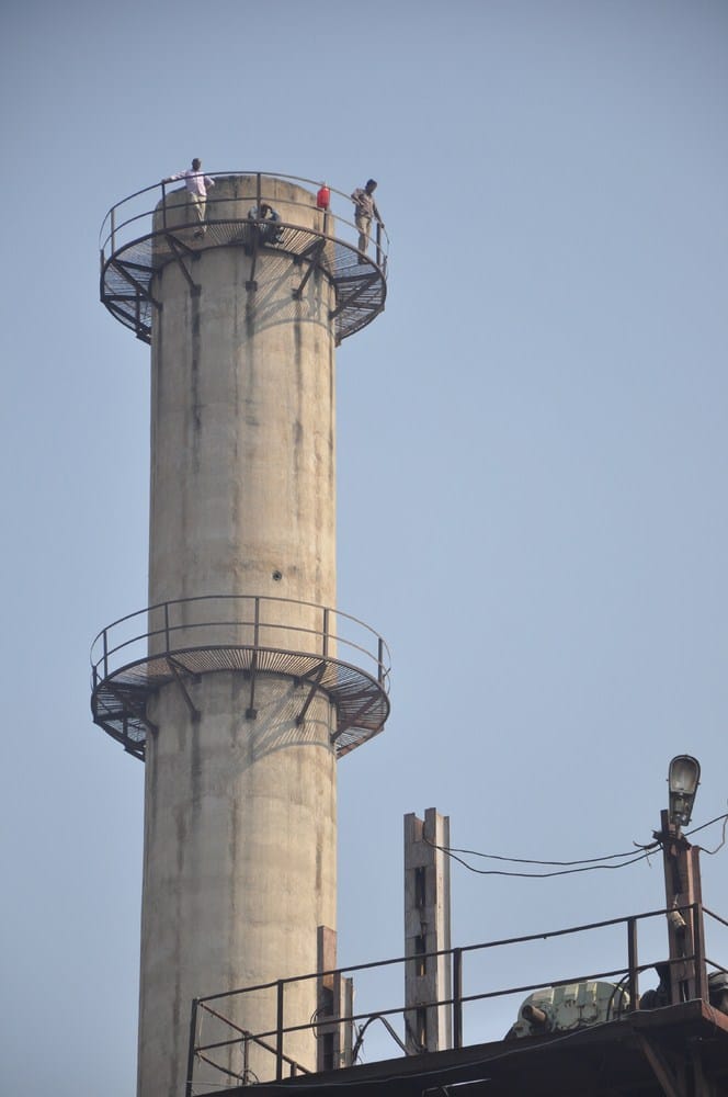 mill worker climbed on chimeny for suicide