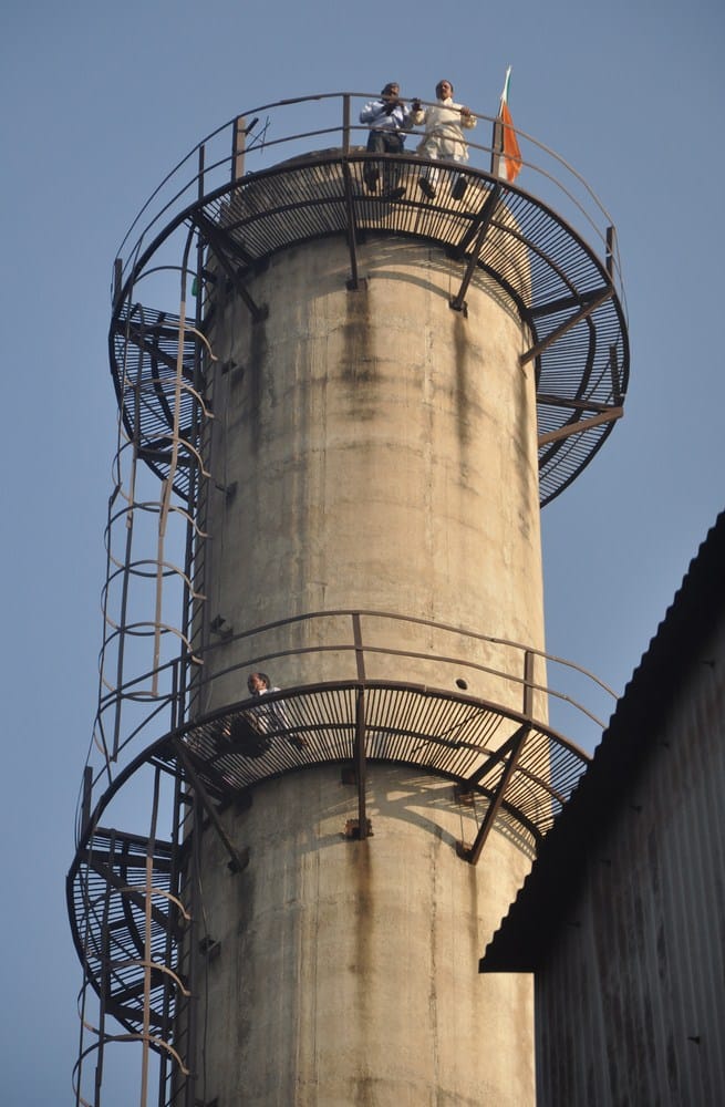 sugar mill workers climbed on cimeny