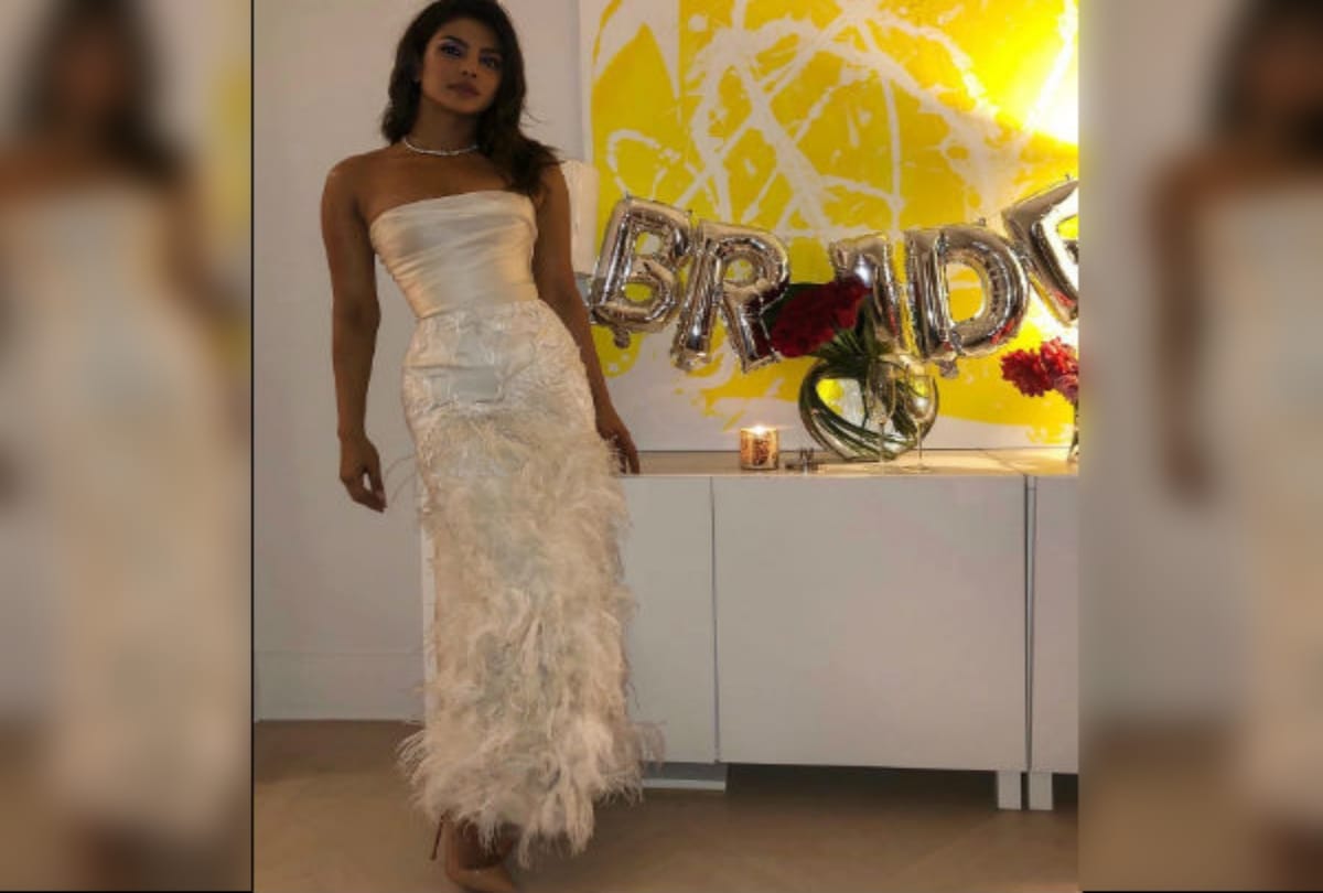 priyanka chopra and nick jonas along with joe jonas and sophie turner in pre wedding puja