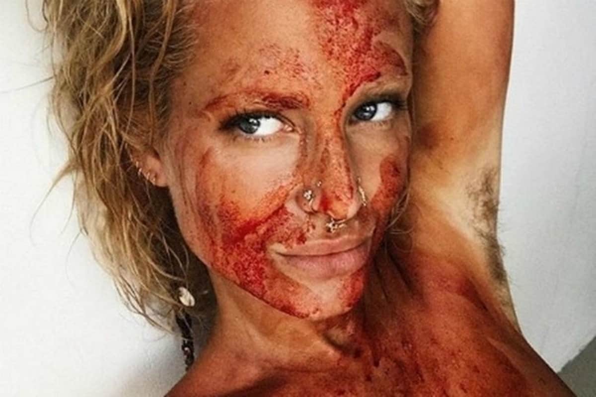 to inspire others Woman covers herself in blood