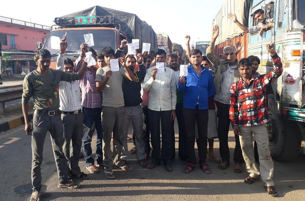 dimonstration of truck drivers standing in queue from four days