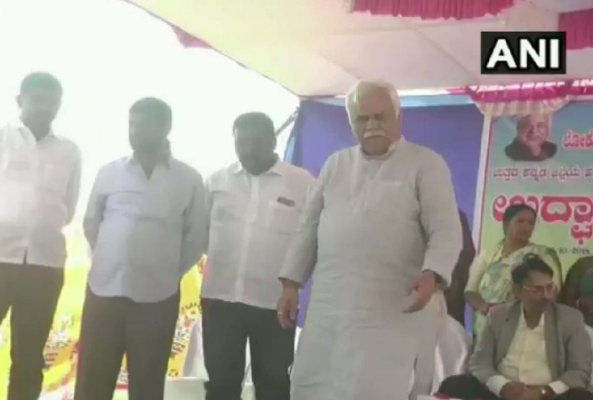 Karnataka minister rv deshpande throws sports kits from a stage at national level athletes