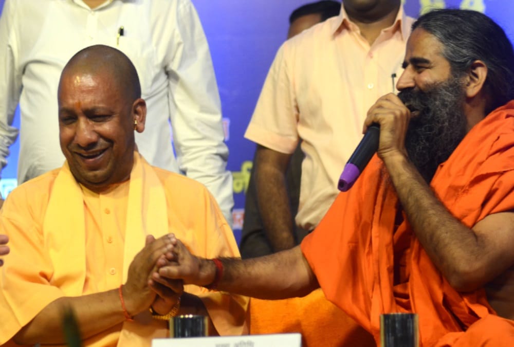 Cm Yogi Adityanath And Baba Ramdev photos in gyan kumbh