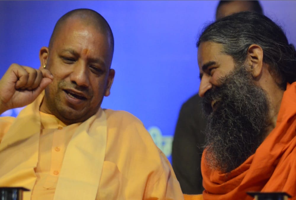 Cm Yogi Adityanath And Baba Ramdev photos in gyan kumbh