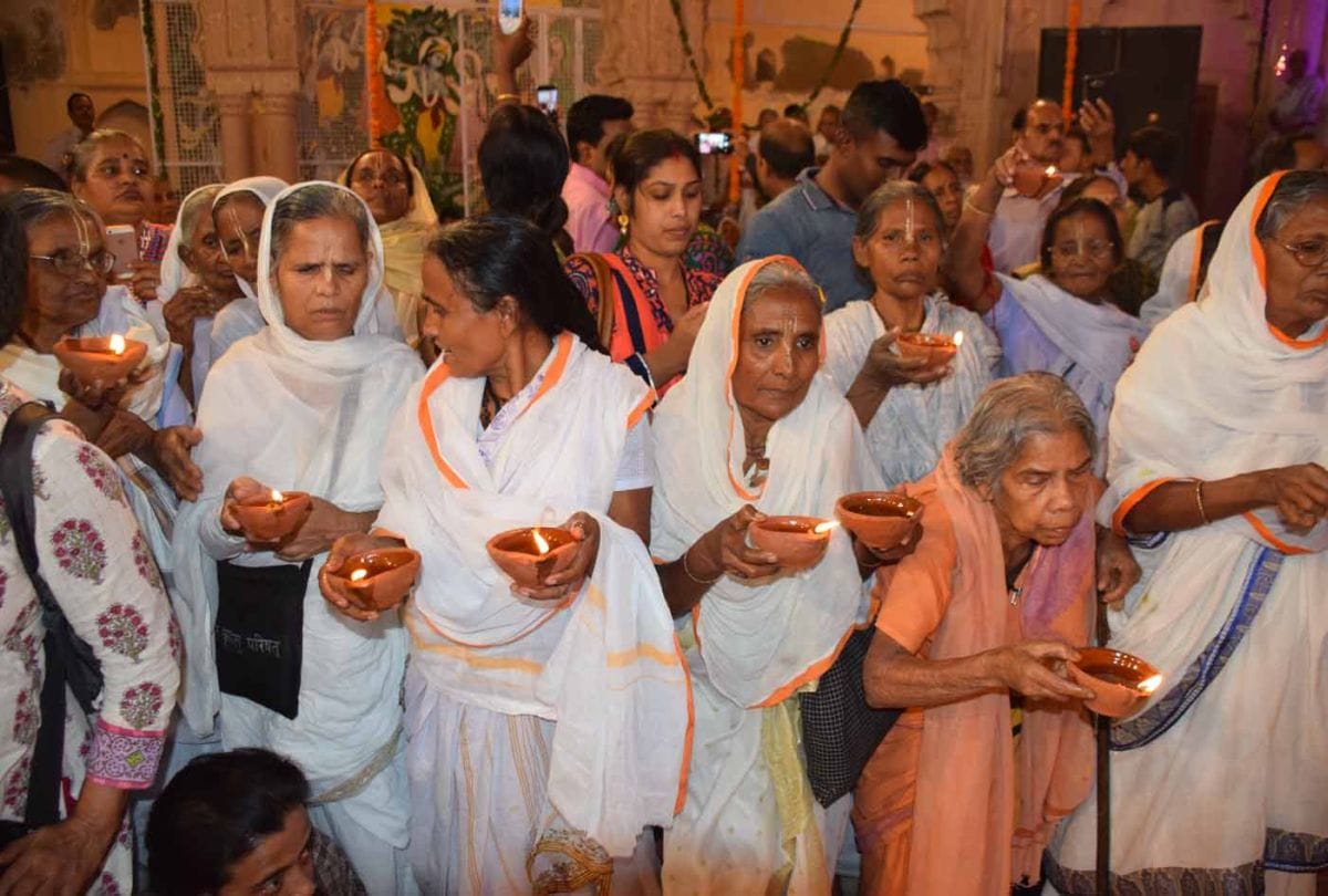Widows cerebrating deepawali in gopinath temple in varindavan
