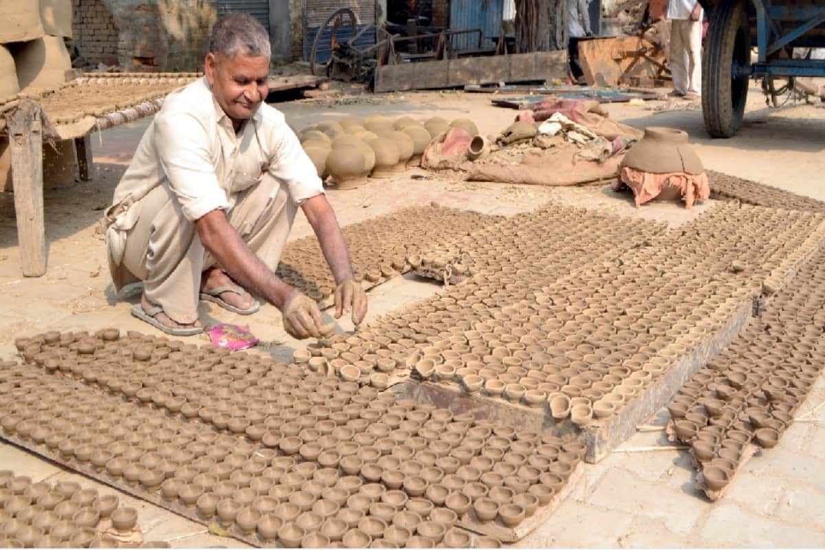 This Deeawali decorate your home with clay lamps beside chinese jhalar
