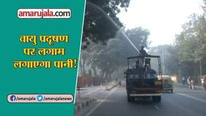 MCD workers sprinkle water in Delhi to settle air pollution