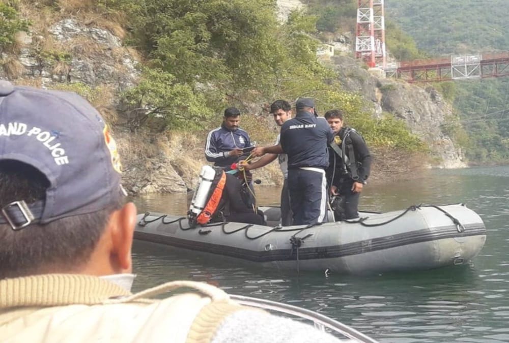 Indian Navy team conduct search operation in tehri dam lake for three missing peoples