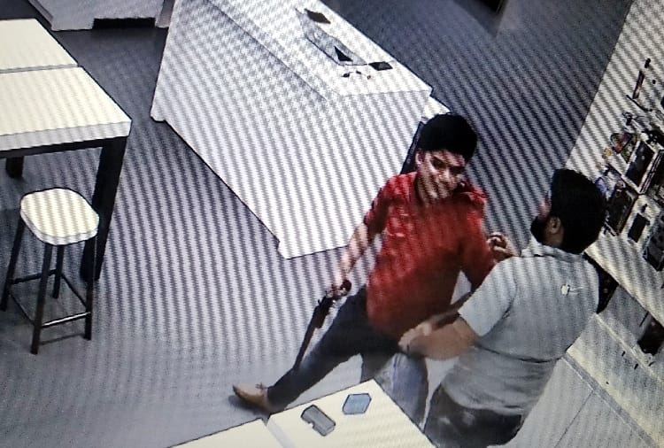 a Student firing on a mobile shop manager in haryana
