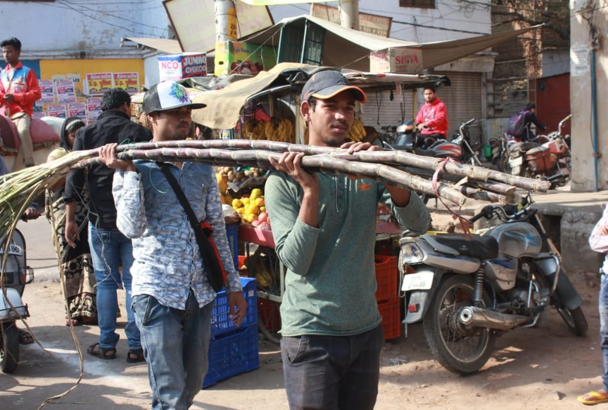 Two international hockey players selling sugarcane in Jhansi