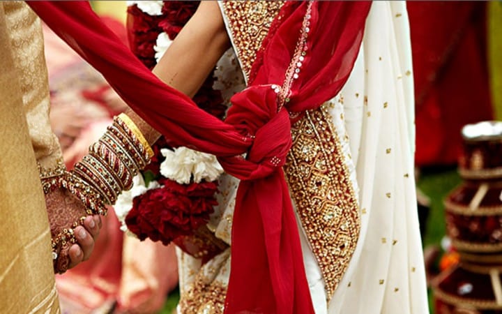 Two wedding processions fight while watching orchestra