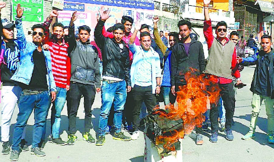 Students blow the statue of the government