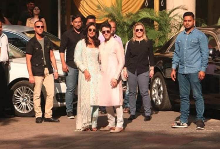priyanka chopra and nick jonas pose for media after pre wedding puja
