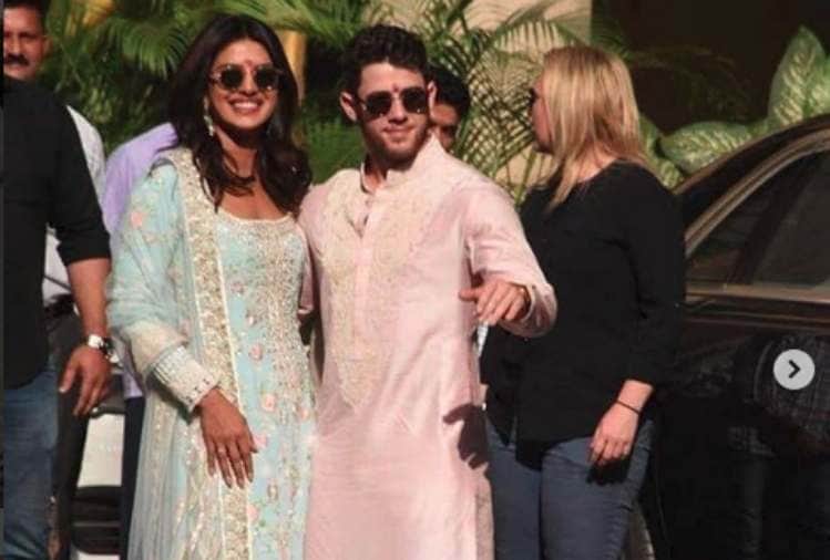 priyanka chopra and nick jonas pose for media after pre wedding puja