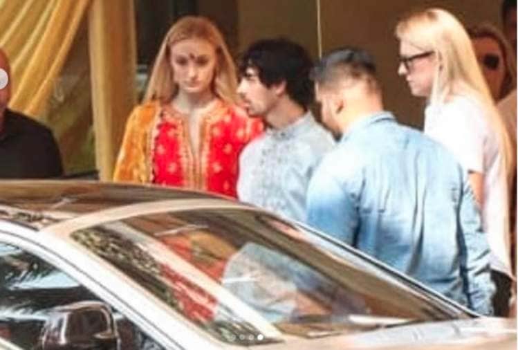 priyanka chopra and nick jonas pose for media after pre wedding puja
