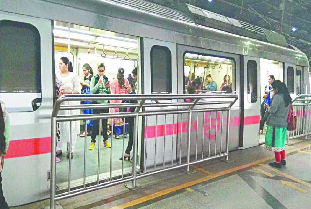 Delhi Metro doors open in front of safety grill on red line