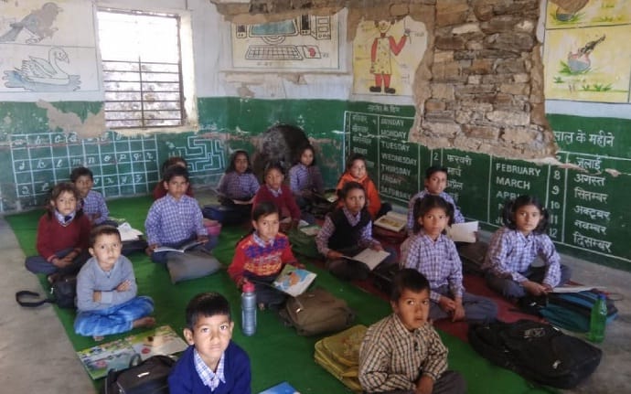 Children reading in a window without cold