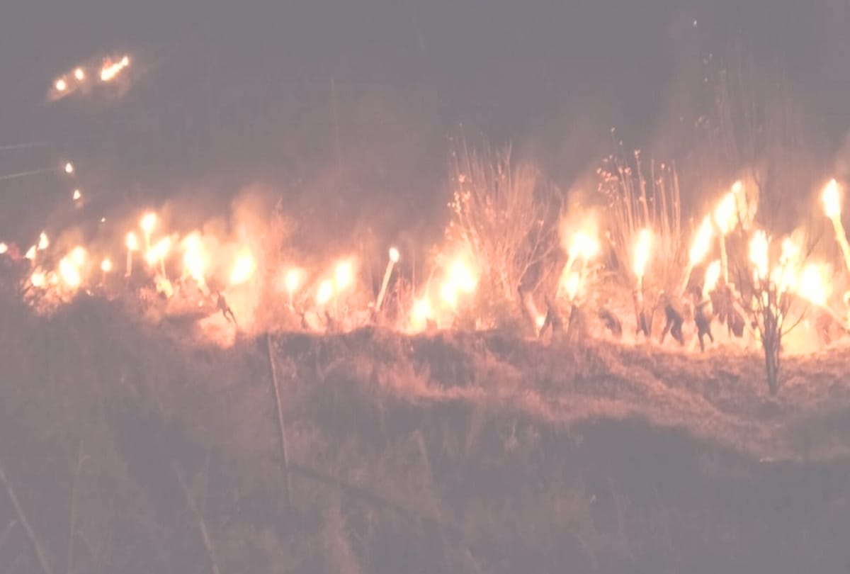 People dance with burning torches in kullu himachal