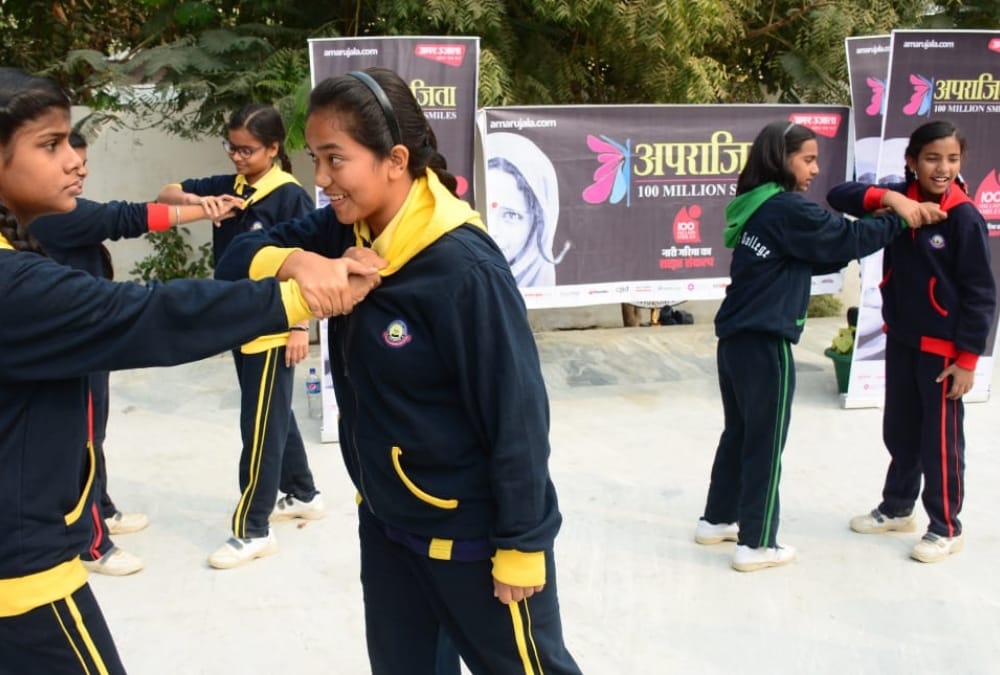 Aprajita gives defence training to school children.
