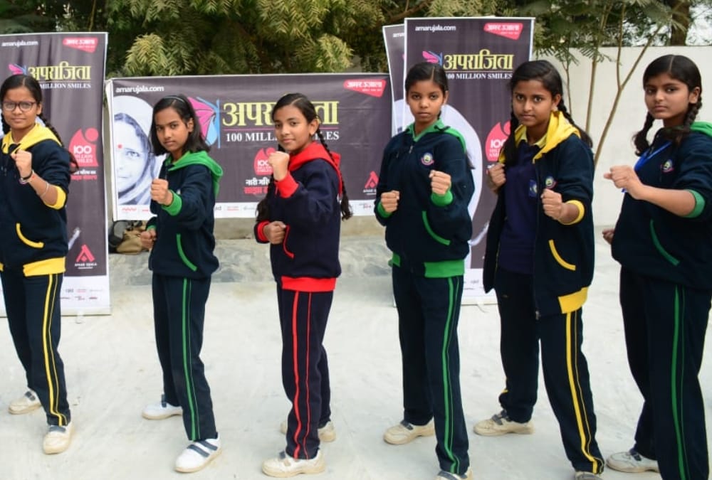 Aprajita gives defence training to school children.
