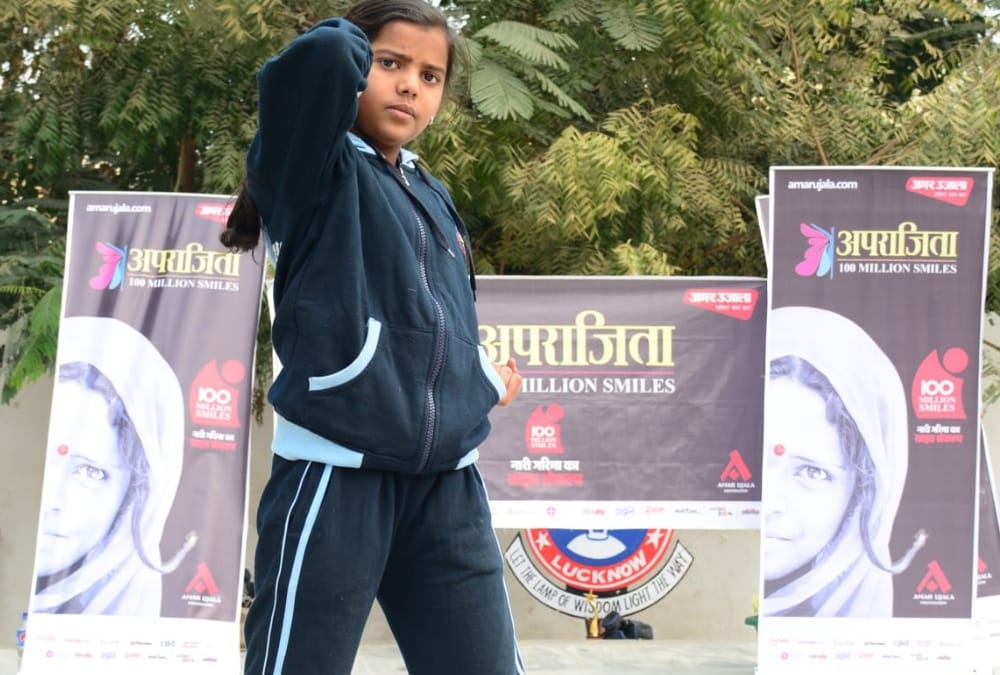 Aprajita gives defence training to school children.